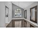 Dining area featuring hardwood floors, modern lighting, and natural light from the window at 4516 Whelk Pl, North Las Vegas, NV 89031