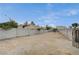 Spacious backyard with a block fence, providing privacy and an open area for various activities at 4625 W Robindale Rd, Las Vegas, NV 89139