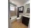 This bathroom features a shower-tub combo, new tile, and a new vanity at 4625 W Robindale Rd, Las Vegas, NV 89139