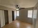 This bedroom features wood floors, closet and a ceiling fan at 4625 W Robindale Rd, Las Vegas, NV 89139