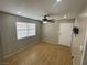 This bedroom features a wood-look floor and a ceiling fan at 4625 W Robindale Rd, Las Vegas, NV 89139