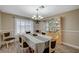 Elegant dining room with hardwood-style floors and built-in china cabinet for convenient storage at 4625 W Robindale Rd, Las Vegas, NV 89139