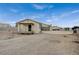 Beige one-story home featuring a covered entryway and a detached garage with a large driveway at 4625 W Robindale Rd, Las Vegas, NV 89139