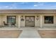 Charming home entrance featuring a covered porch and double door entry at 4625 W Robindale Rd, Las Vegas, NV 89139