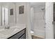 Bright bathroom featuring a single sink vanity and tub-shower combo at 4733 Cactus Sun Ln, North Las Vegas, NV 89031