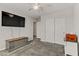 Spacious bedroom with a closet, ceiling fan and large television at 4733 Cactus Sun Ln, North Las Vegas, NV 89031