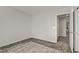 Bright bedroom with a patterned rug and adjacent hallway view at 4733 Cactus Sun Ln, North Las Vegas, NV 89031