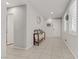 Inviting hallway with tile floors, neutral walls, and a decorative console table to the right at 4733 Cactus Sun Ln, North Las Vegas, NV 89031