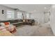 Relaxing living room with oversized sectional sofa, neutral tones, and multiple windows at 4733 Cactus Sun Ln, North Las Vegas, NV 89031