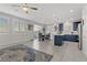 Bright open floorplan with tile floors flowing from the living area to the kitchen and dining space at 4733 Cactus Sun Ln, North Las Vegas, NV 89031