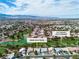 Wide angle aerial view of 5209 Rim View and community, highlighting proximity to Los Prados golf course at 5209 Rim View Ln, Las Vegas, NV 89130