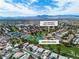 Aerial view featuring a community nestled near a golf course with mountain views at 5209 Rim View Ln, Las Vegas, NV 89130