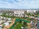 Aerial view of the home and the surrounding golf course with mountain views in the background at 5209 Rim View Ln, Las Vegas, NV 89130