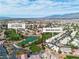 Picturesque aerial of the Los Prados golf course community with lush greens and tree coverage at 5209 Rim View Ln, Las Vegas, NV 89130