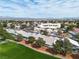 Bright aerial shot of a single-story house backing onto a golf course and community at 5209 Rim View Ln, Las Vegas, NV 89130