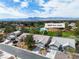 Exceptional aerial view of a gray single-story house overlooking a golf course and mountain views at 5209 Rim View Ln, Las Vegas, NV 89130