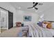 A well-lit bedroom features a sliding barn door to an ensuite bathroom at 5209 Rim View Ln, Las Vegas, NV 89130