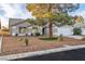 Attractive single-story home featuring a neatly landscaped front yard and a two-car garage at 5209 Rim View Ln, Las Vegas, NV 89130