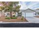 Charming single-story home with a well-manicured front yard and a two-car garage at 5209 Rim View Ln, Las Vegas, NV 89130