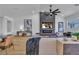 Bright living room with a vaulted ceiling, modern fireplace, and open layout at 5209 Rim View Ln, Las Vegas, NV 89130