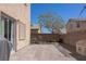 Paver patio in backyard with rock landscaping, greenery, and partial shade from a tree at 53 Hoke Edward Ct, North Las Vegas, NV 89031