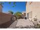 Backyard patio with stone landscaping and block wall at 53 Hoke Edward Ct, North Las Vegas, NV 89031