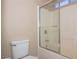 Bathroom with a toilet and a shower with glass doors at 53 Hoke Edward Ct, North Las Vegas, NV 89031