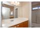 Bathroom featuring a sink with wood cabinets at 53 Hoke Edward Ct, North Las Vegas, NV 89031