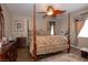 Bedroom with a four poster bed, wood flooring and a ceiling fan at 53 Hoke Edward Ct, North Las Vegas, NV 89031