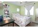 Bedroom with an abundance of natural light, featuring a bed and a desk at 53 Hoke Edward Ct, North Las Vegas, NV 89031