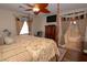 Bedroom featuring wood furniture, floral bedding, and an en-suite bathroom at 53 Hoke Edward Ct, North Las Vegas, NV 89031