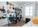 Bright bedroom featuring a workspace area, storage shelves, and a window at 53 Hoke Edward Ct, North Las Vegas, NV 89031