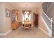 Bright dining room featuring modern chandelier, neutral paint, and a staircase at 53 Hoke Edward Ct, North Las Vegas, NV 89031