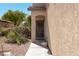 Inviting front door with a wreath, set within a well-maintained desert landscape at 53 Hoke Edward Ct, North Las Vegas, NV 89031