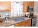 Kitchen featuring tile floor, granite countertops, stainless appliances, and a window at 53 Hoke Edward Ct, North Las Vegas, NV 89031