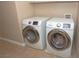 Laundry room with a white front-loading Samsung washer and dryer at 53 Hoke Edward Ct, North Las Vegas, NV 89031