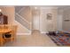 Inviting living room showcasing a staircase, chair and colorful rug at 53 Hoke Edward Ct, North Las Vegas, NV 89031