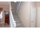 Carpeted staircase with white railing and trim, leading to the upper level at 53 Hoke Edward Ct, North Las Vegas, NV 89031