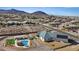 Expansive aerial view showcasing the home's backyard and neighborhood views at 541 Patti Ann Woods Dr, Henderson, NV 89002