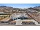 Expansive aerial view showcasing the home's backyard and neighborhood views at 541 Patti Ann Woods Dr, Henderson, NV 89002