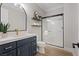 Modern bathroom features a sleek vanity with gold hardware and a glass-enclosed shower at 541 Patti Ann Woods Dr, Henderson, NV 89002