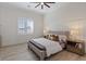 Stylish bedroom features light wood floors, large window with plantation shutters and contemporary furnishings at 541 Patti Ann Woods Dr, Henderson, NV 89002