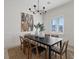 Contemporary dining room featuring a stylish black table and seating for eight at 541 Patti Ann Woods Dr, Henderson, NV 89002