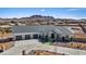 Stunning single-story home featuring a three-car garage and professionally landscaped front yard with mountain views at 541 Patti Ann Woods Dr, Henderson, NV 89002