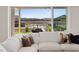 Bright living room view to the backyard featuring a pool, seating and outdoor kitchen at 541 Patti Ann Woods Dr, Henderson, NV 89002