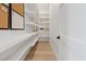 Bright pantry featuring white shelving providing plenty of storage space for kitchen essentials and supplies at 541 Patti Ann Woods Dr, Henderson, NV 89002