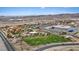 Aerial view of a Gathering-friendly park featuring a playground, baseball field, and green space in a suburban neighborhood at 541 Patti Ann Woods Dr, Henderson, NV 89002