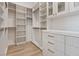 This walk-in closet provides ample storage with custom shelving and drawer units for organization at 541 Patti Ann Woods Dr, Henderson, NV 89002