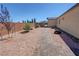 Charming backyard with gravel and paver pathway at 5528 Eleganza Ave, Pahrump, NV 89061