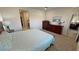 Comfortable bedroom with a king-size bed, soft carpet, and modern furnishings at 5528 Eleganza Ave, Pahrump, NV 89061